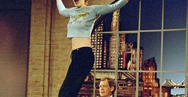 drew barrymore dancing on a late night desk