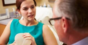 a doctor explaining the different types of breast augmentation