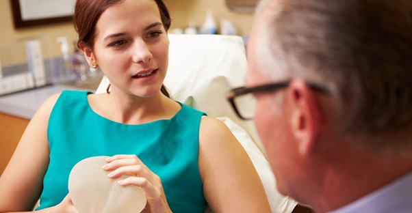 a doctor explaining the different types of breast augmentation