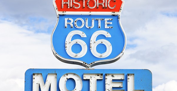a sign for historic route 66 motel in arizona