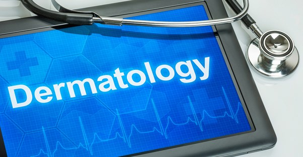 a dermatologist's tablet containing information on tattoo removal