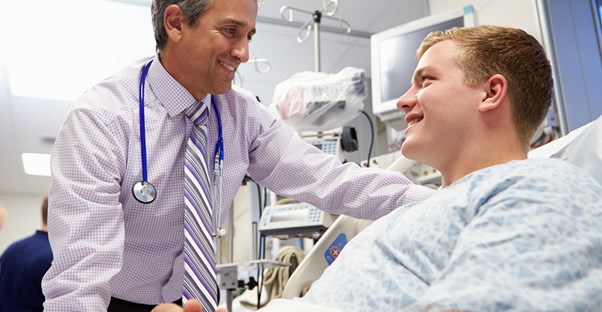 a doctor helping his patient understand gynecomastia
