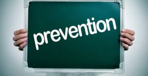 a doctor who is talking to a patient about how to prevent gynecomastia causes