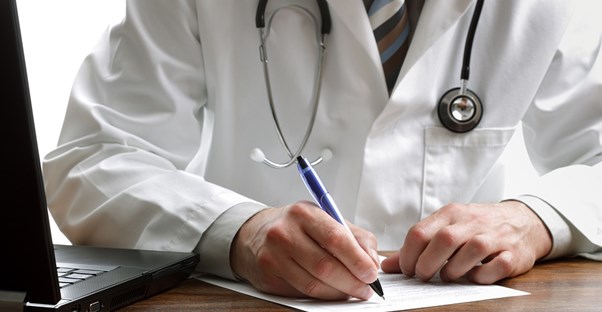 a doctor diagnosing gynecomastia