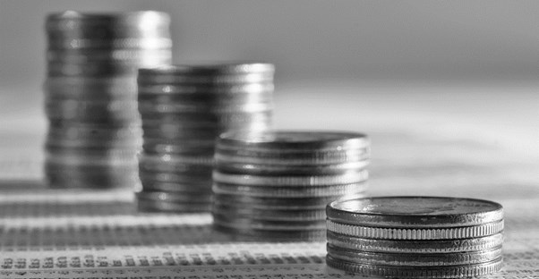 Stacks of quarters increasing in height to represent the five reasons you shouldn't invest in mutual funds.