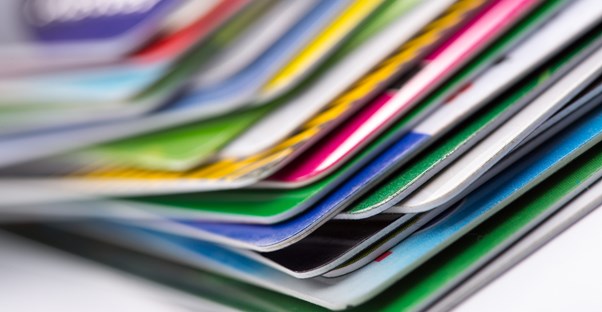 A pile of credit cards being consolidated into one payment.