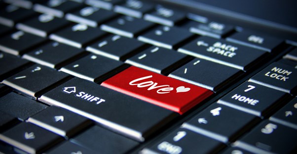 a computer keyboard with a button marked love