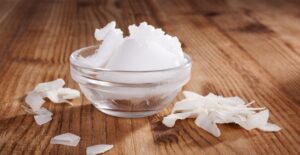 a glob of coconut oil waits for application on hair