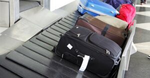 luggage sits on a conveyor belt ready to be picked up