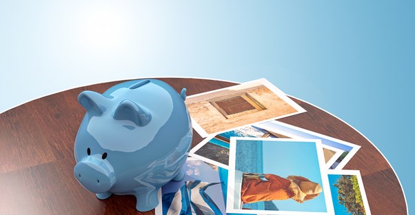 a piggy bank sits on a table with pictures of a family's travel
