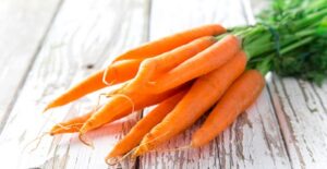 a bunch of carrots sits ready to eat on the counter