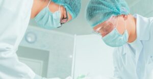 two tummy tuck surgeons