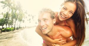 a young couple enjoy each others company in a tropical paradise
