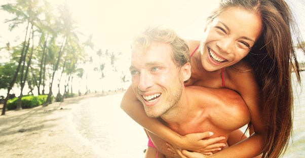 a young couple enjoy each others company in a tropical paradise