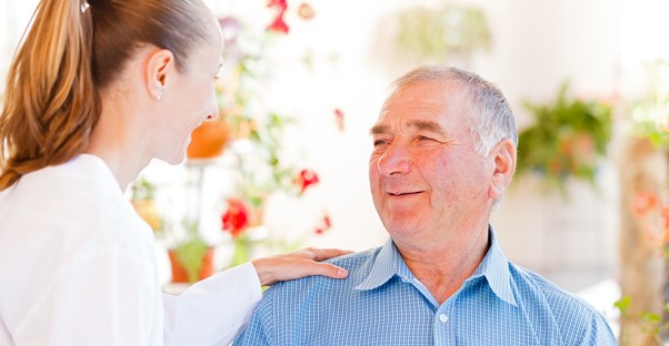 a woman and man discuss dementia treatment options
