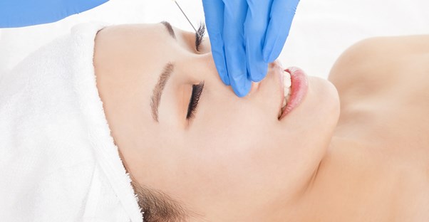 a woman who is aware of the health risks of rhinoplasty