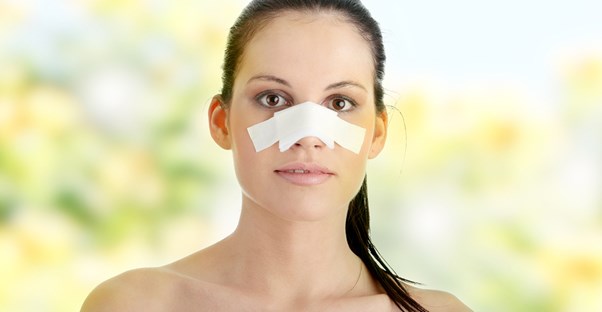 a woman who is recovering from rhinoplasty