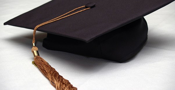 A graduation cap earned at an out-of-state school that was paid for with out-of-state scholarships.
