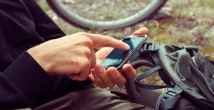 a guy plays with his GPS on his phone