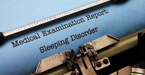 a typewriter typing sentences about sleep apnea and narcolepsy