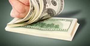 A man flips through the thousands of dollars he saved in taxes with the child tax credit.