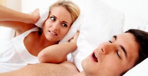 a man suffering from sleep apnea symptoms
