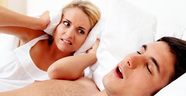a man suffering from sleep apnea symptoms