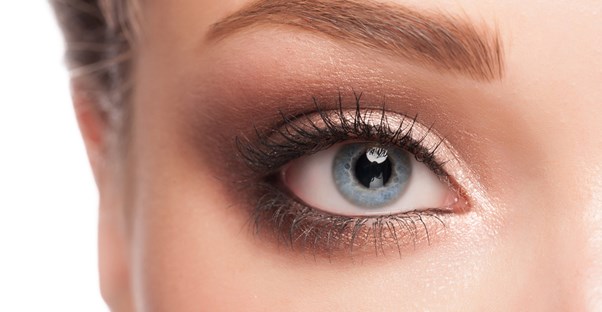 a close up of a woman and her eyebrow