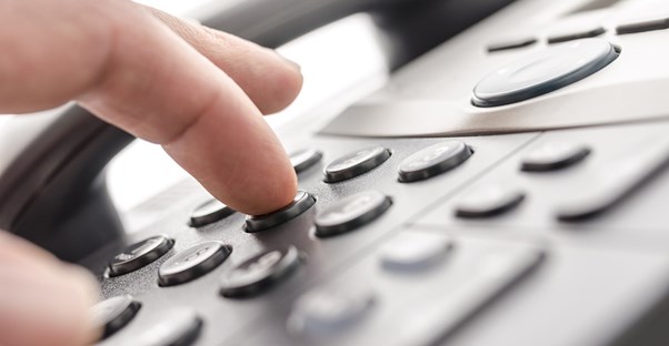 A close up of a complimentary phone from one of the best business phone services.