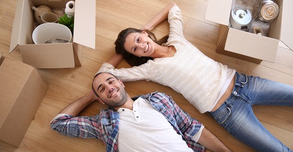 A couple smiling because a USDA home loan allowed them to purchase their dream home.