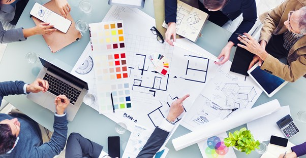 An interior design team discusses how they can improve their salaries.