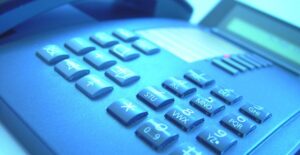 A small business's office phone received through a business phone service.