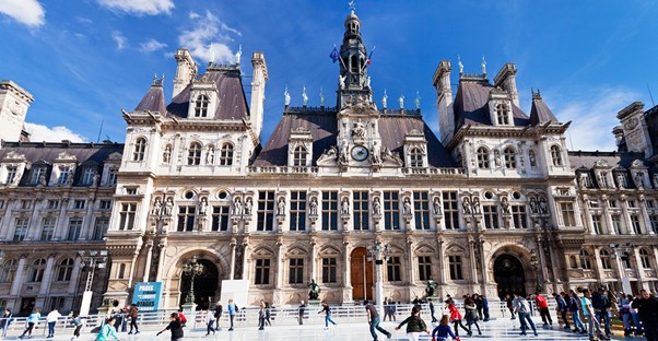 Paris visitors ice skate outside a famous landmark