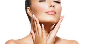 a woman caresses her own airbrushed face