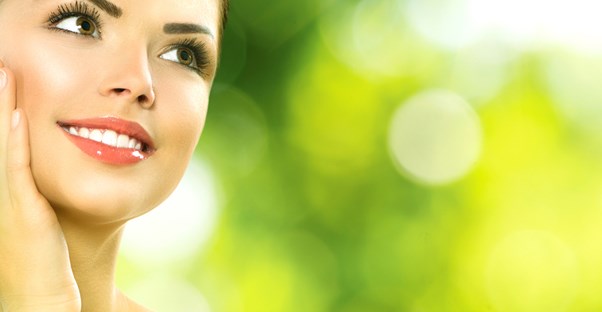 a woman enjoys her light makeup during the heat of summer
