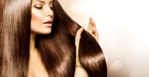 a woman examines her hair extensions