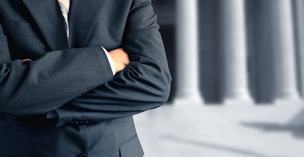 Paralegal in a suit looking too cool for school