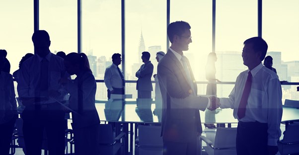 Paralegals shake hands and network