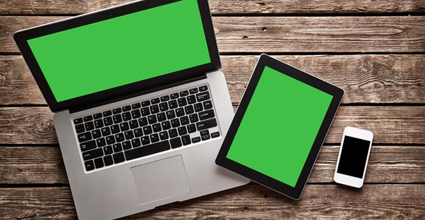 A laptop, tablet, and smart phone connected to a small business wireless internet.