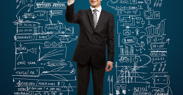 Nerdy Guy Drawing On Chalkboard