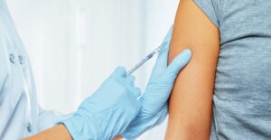 A CNA gives a patient a shot