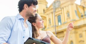 a couple uses a travel app to navigate the city