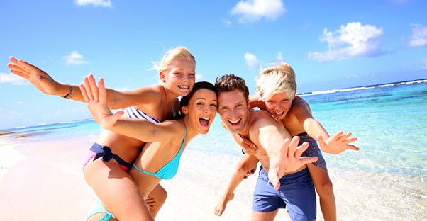a family enjoys their time at the beach