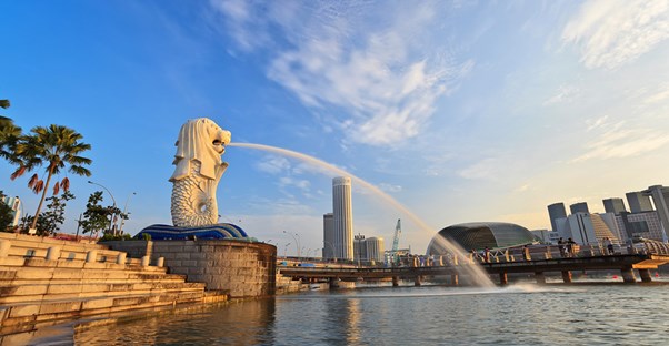 the original merlion of singapore sprays water into the harbor