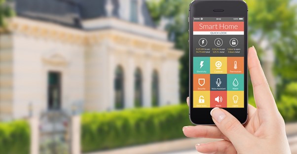 A woman operates her home automation system from outside her home.