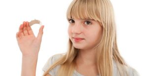 a child with a hearing aid