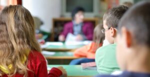 Students try to stay awake while a substitute teacher teaches