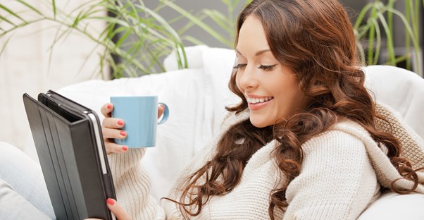 A homeowners smiles when hearing the home automation system has increased the market value of her house.