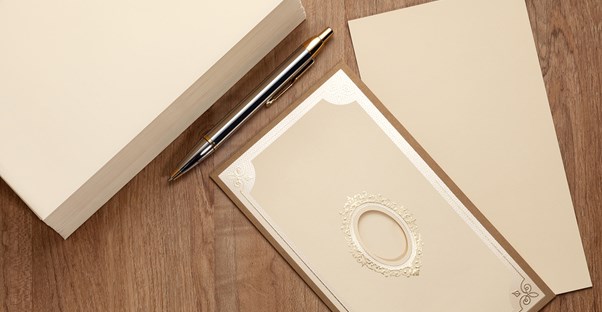 Boxes of inexpensive wedding invitations ordered from a website