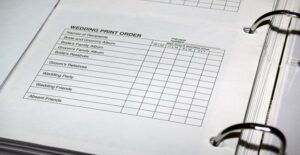 A wedding binder containing information over wedding invitations